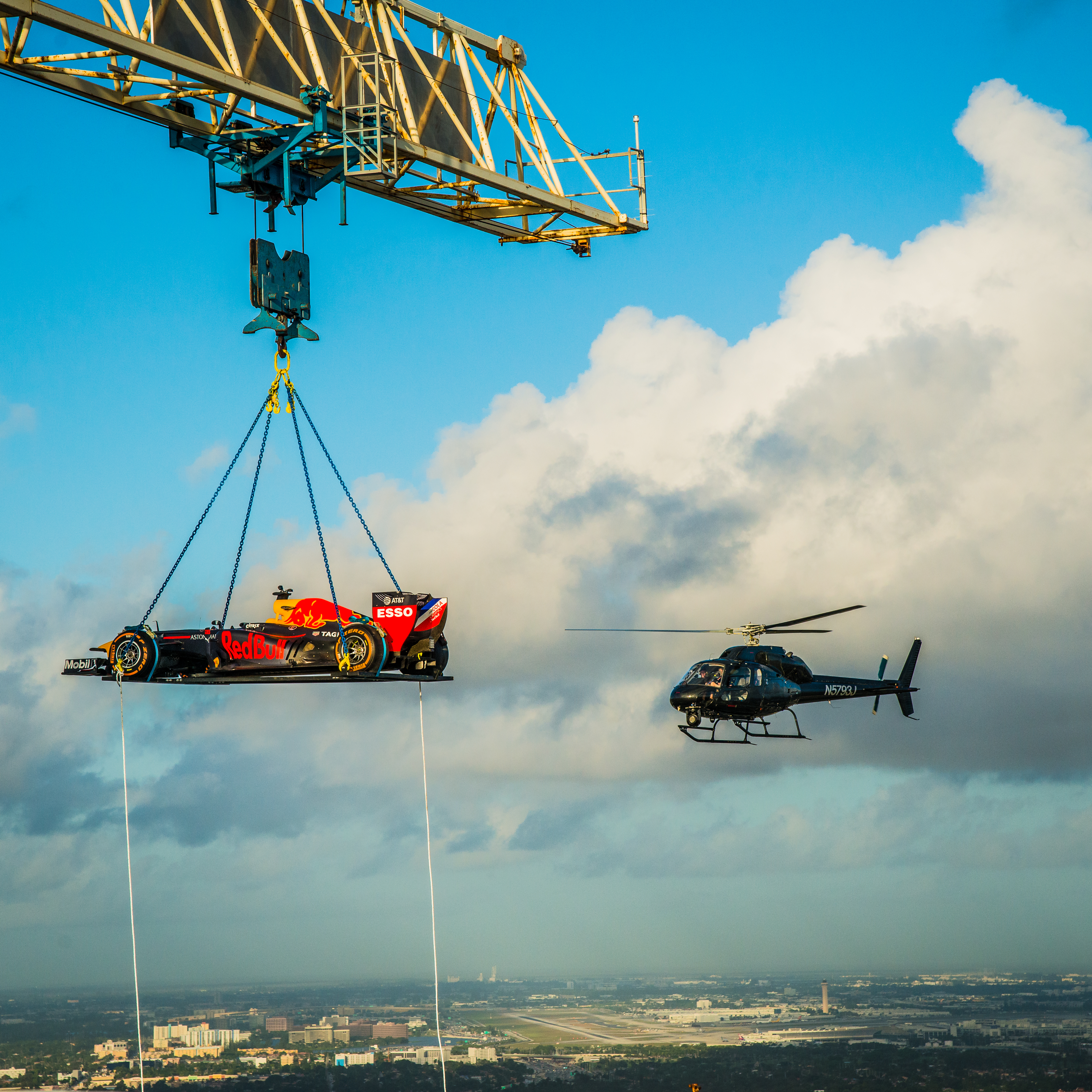 Crane lifting an F1 car for a Red Bull marketing event
