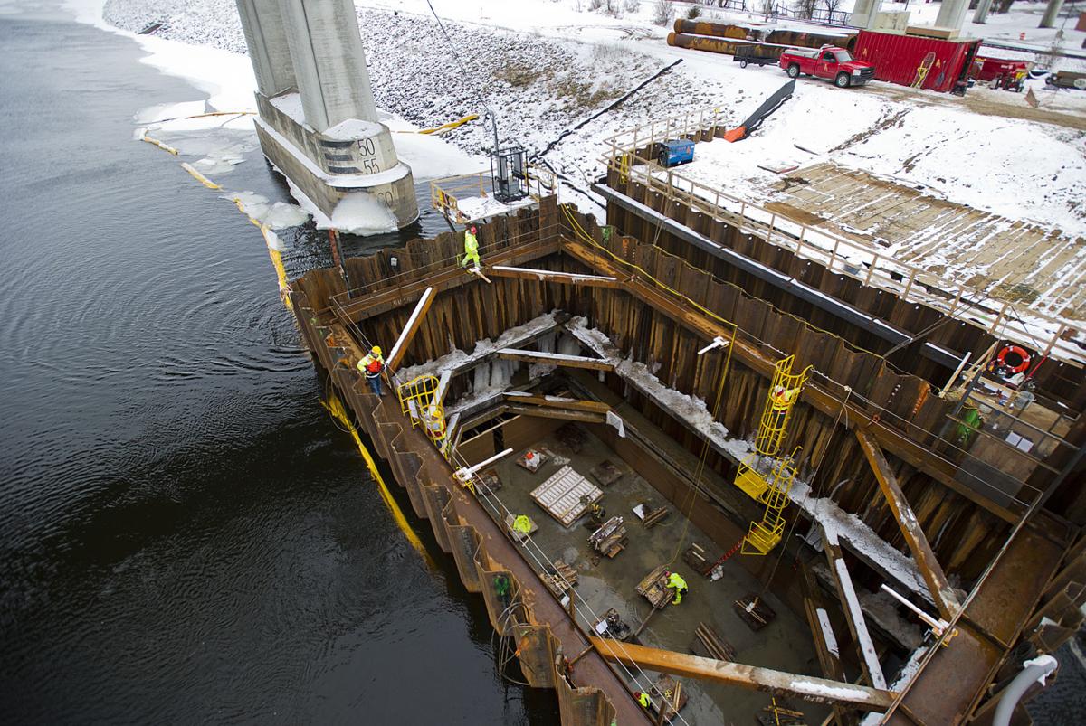 Sheet pile cofferdam during winter bridge pier construction