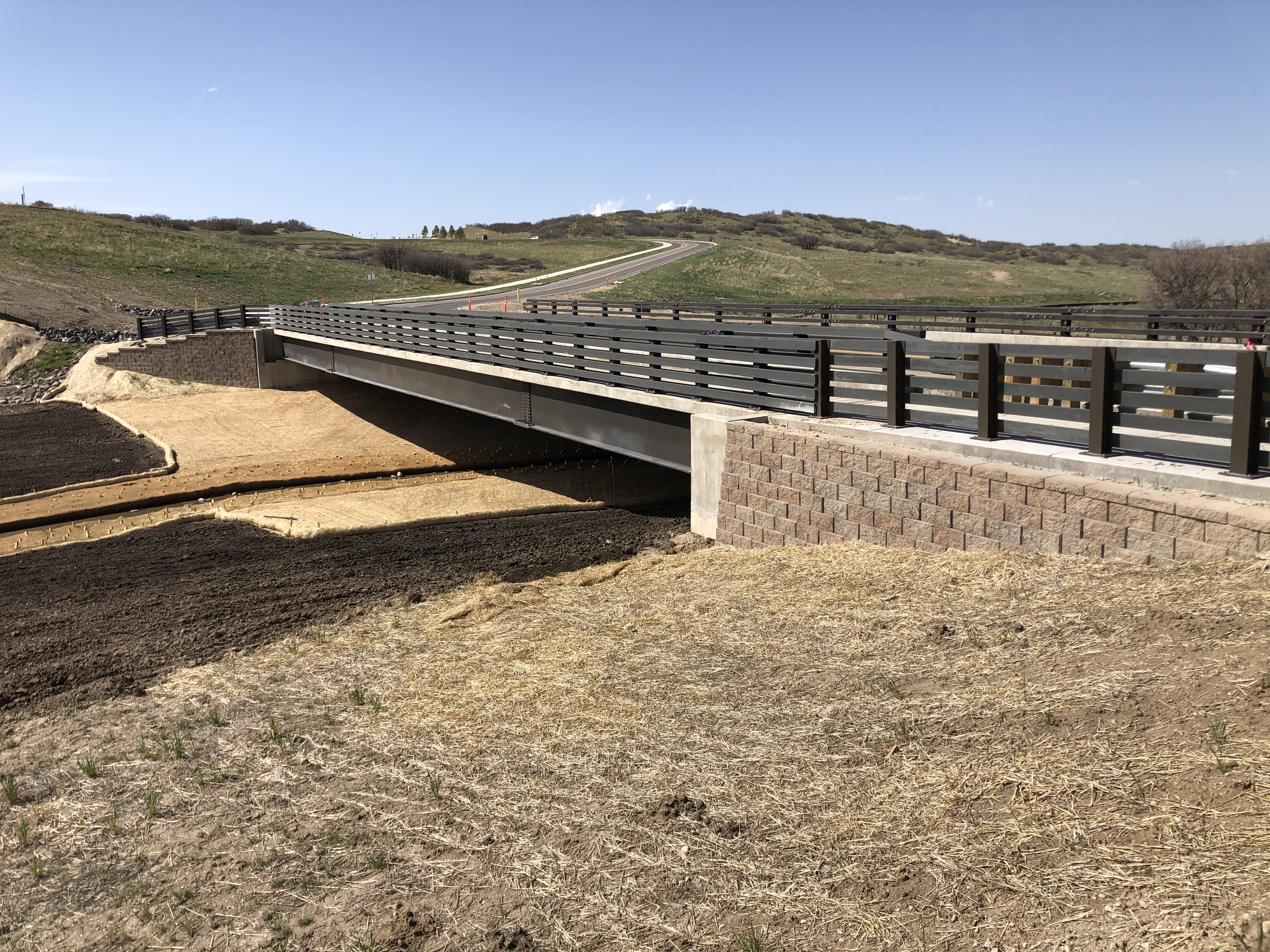 Concrete bridge in service over a rural alignment